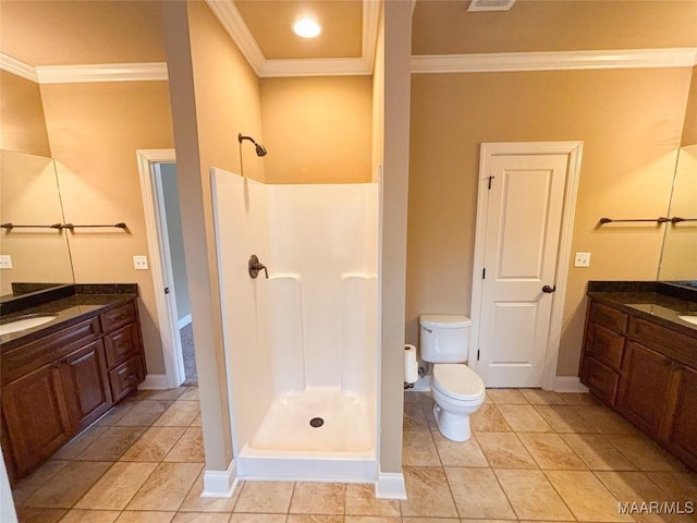 bathroom with vanity, toilet, walk in shower, and ornamental molding