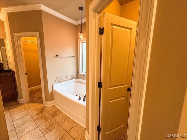 bathroom with a bathing tub, crown molding, and tile patterned floors