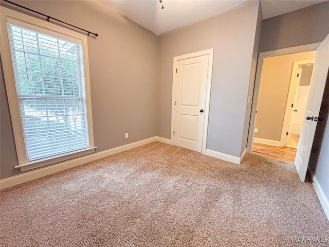 unfurnished bedroom featuring carpet