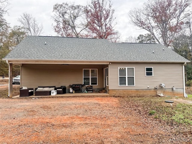 back of property with a patio and an outdoor hangout area