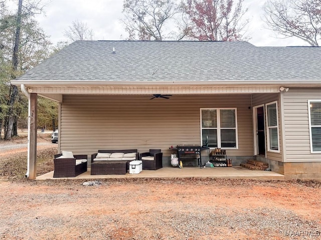 back of property featuring an outdoor hangout area, a patio, and ceiling fan