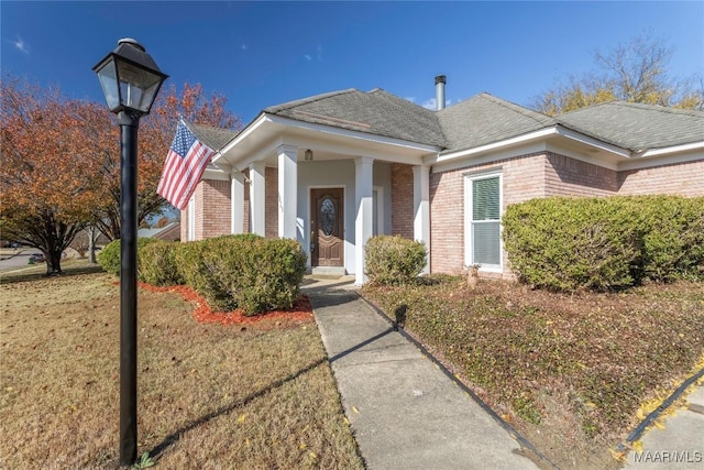 view of front of property with a front lawn