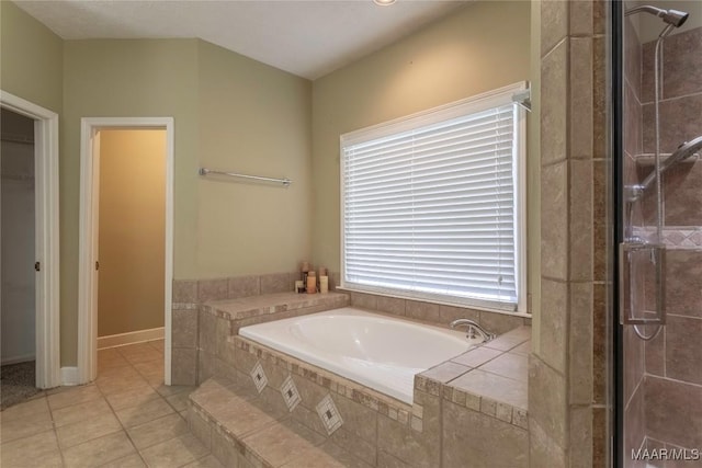 bathroom with tile patterned floors and separate shower and tub