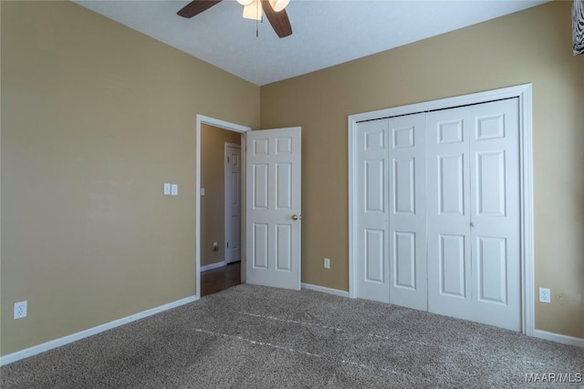 unfurnished bedroom featuring carpet, ceiling fan, and a closet