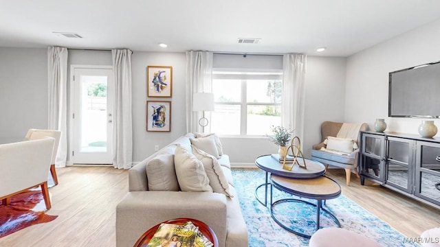 living room with light hardwood / wood-style flooring