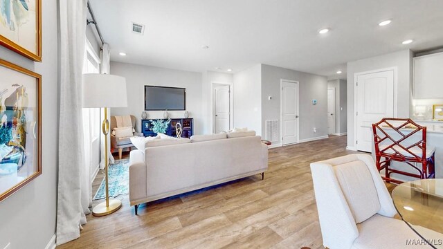 living room with light hardwood / wood-style floors