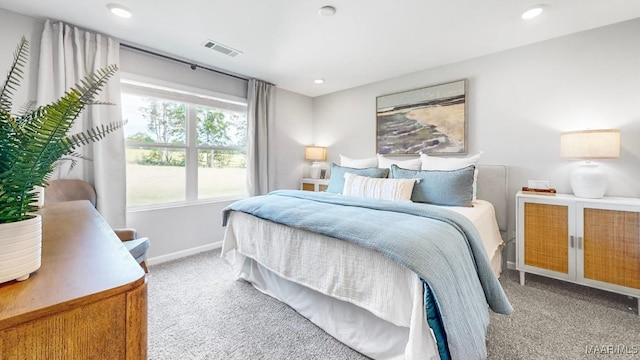 bedroom with light colored carpet