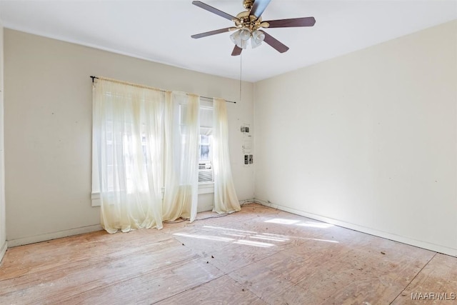 spare room featuring ceiling fan and light hardwood / wood-style floors