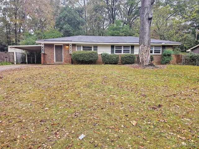 ranch-style home with a carport and a front yard