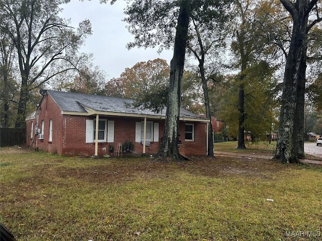 ranch-style home with a front lawn