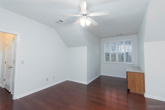 bonus room featuring vaulted ceiling, ceiling fan, and dark wood-type flooring