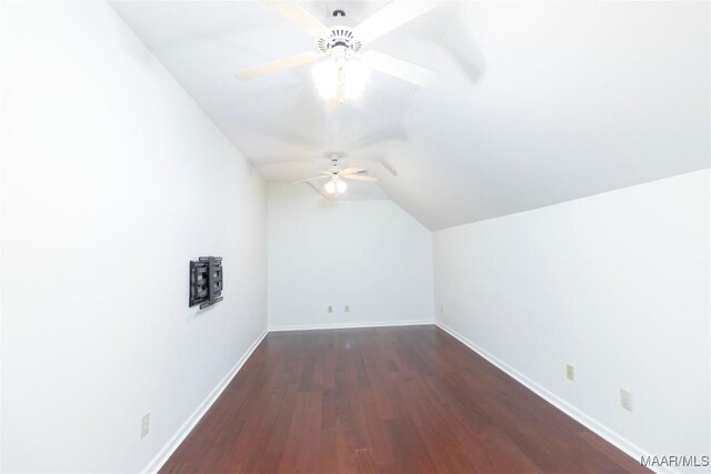 bonus room with ceiling fan, dark hardwood / wood-style flooring, and lofted ceiling