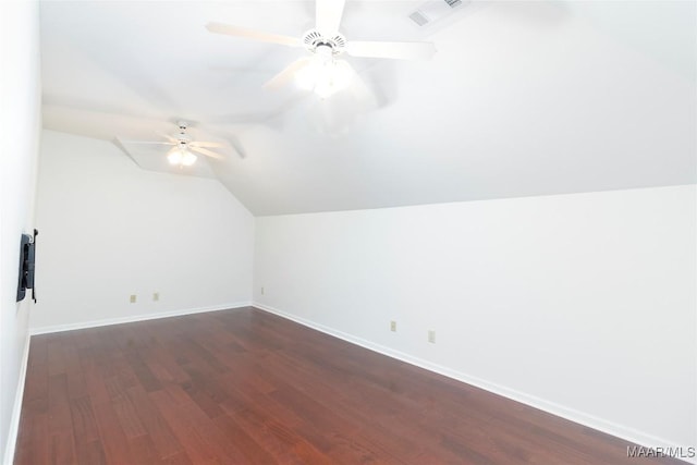 additional living space with lofted ceiling, ceiling fan, and dark hardwood / wood-style floors