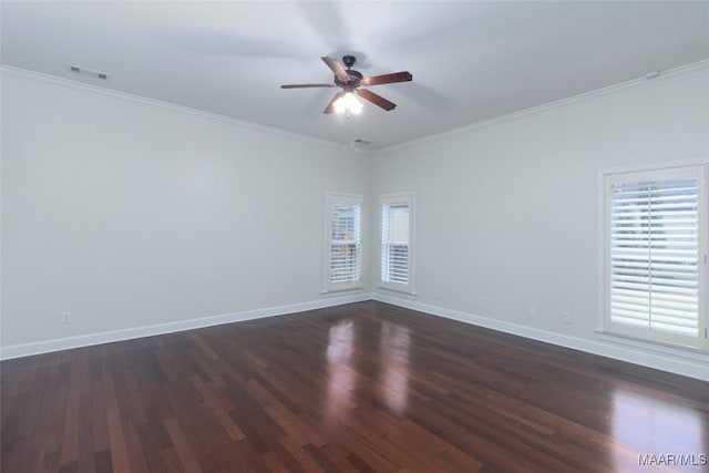 empty room featuring crown molding, ceiling fan, and dark hardwood / wood-style floors