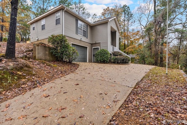 view of side of property with a garage