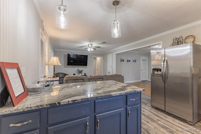 kitchen featuring hanging light fixtures, ceiling fan, ornamental molding, blue cabinetry, and stainless steel fridge with ice dispenser