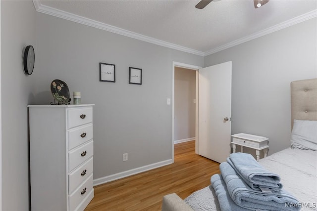 bedroom with a textured ceiling, light hardwood / wood-style flooring, ceiling fan, and crown molding