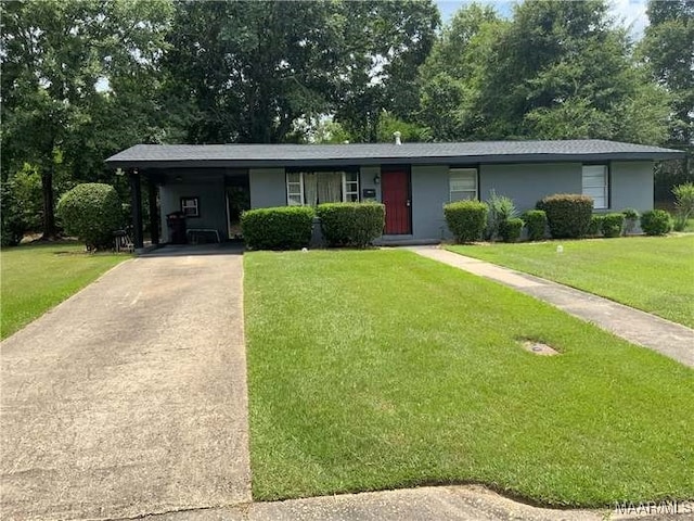 ranch-style house featuring a carport and a front yard