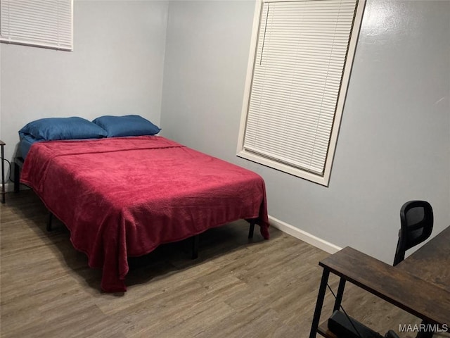 bedroom with hardwood / wood-style floors