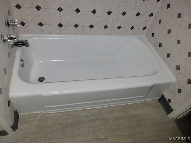 bathroom with a washtub