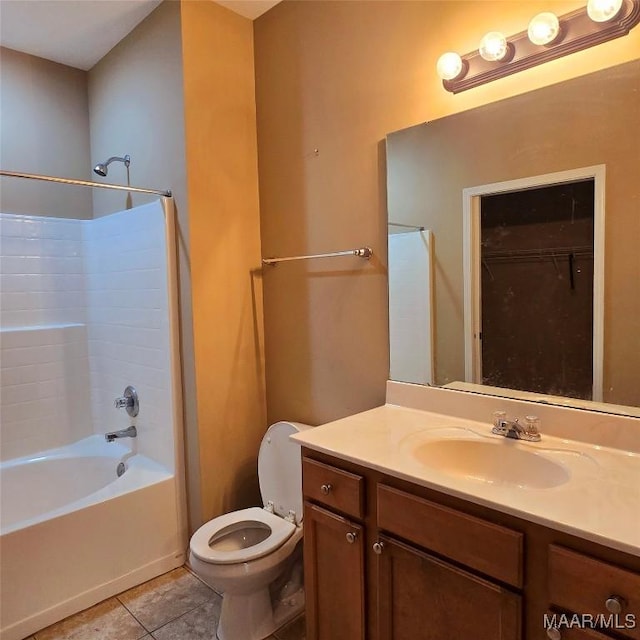 full bathroom featuring tile patterned floors, toilet, vanity, and tub / shower combination