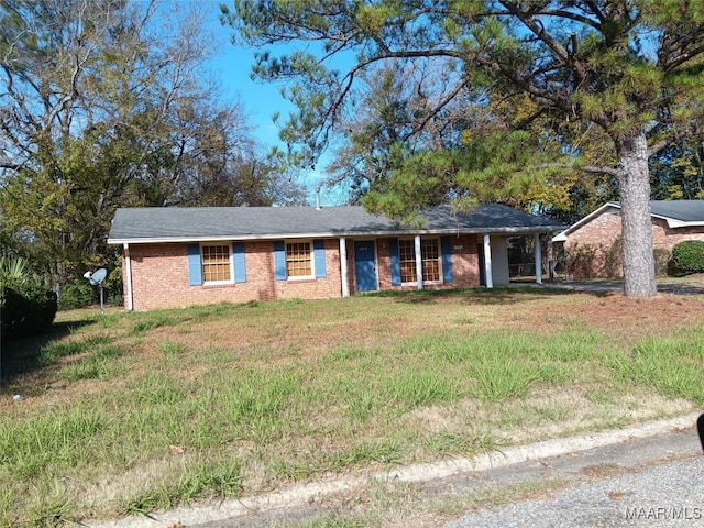 ranch-style home with a front yard