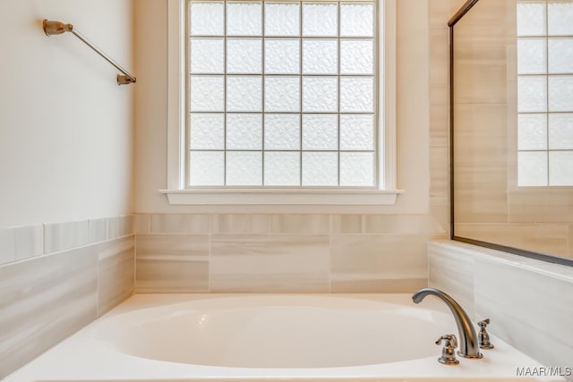 bathroom with a garden tub