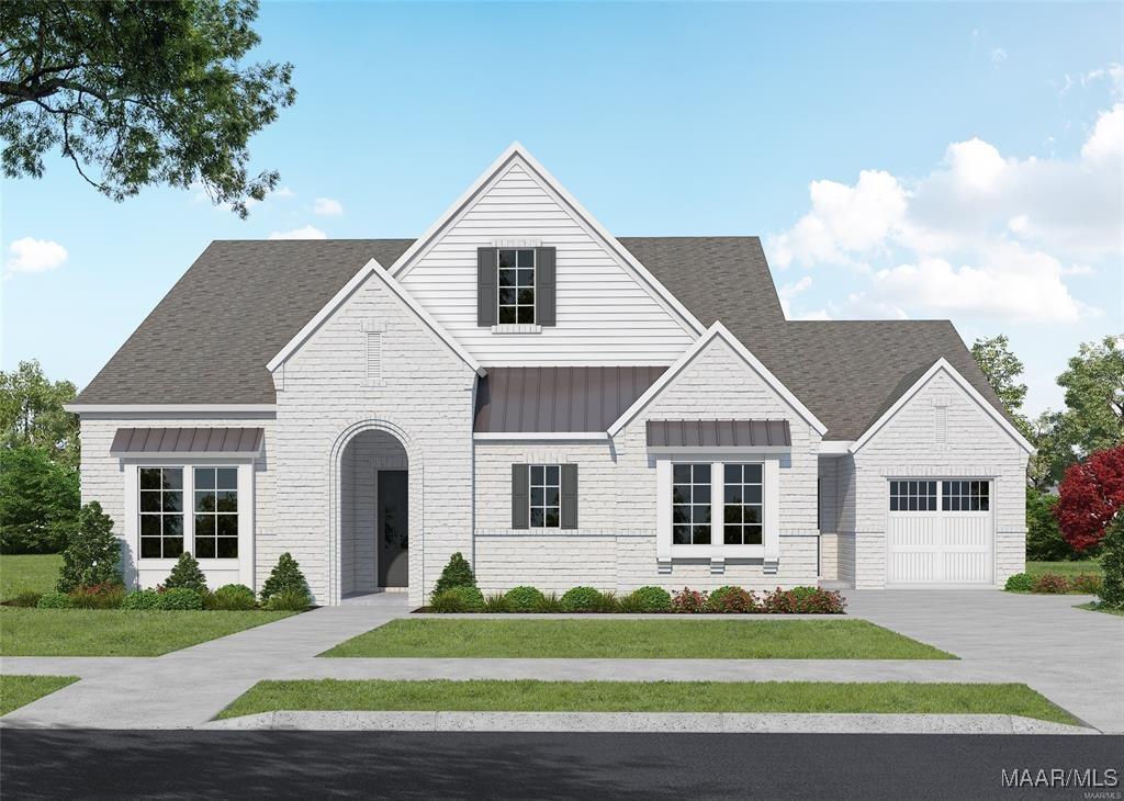 view of front of house featuring a garage and a front yard