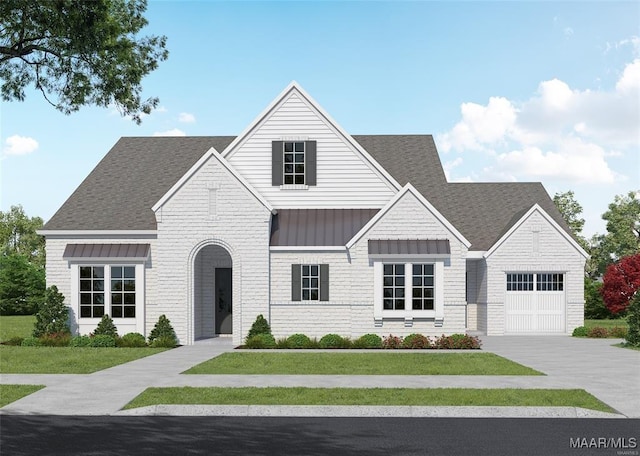 view of front of house featuring a garage and a front yard