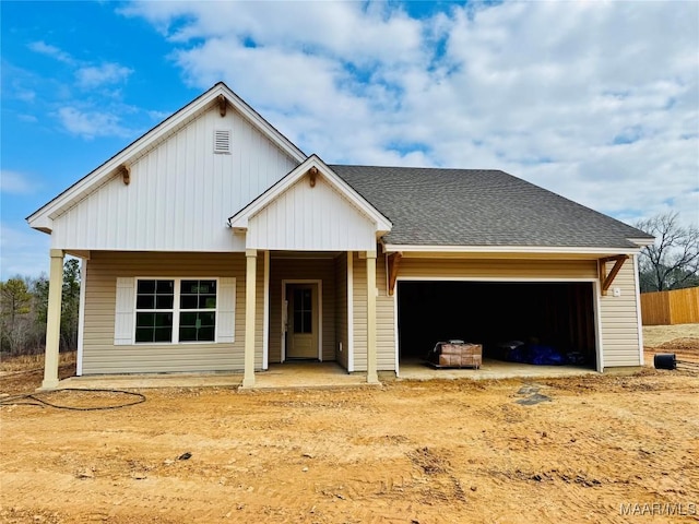 view of front facade featuring a garage and covered porch