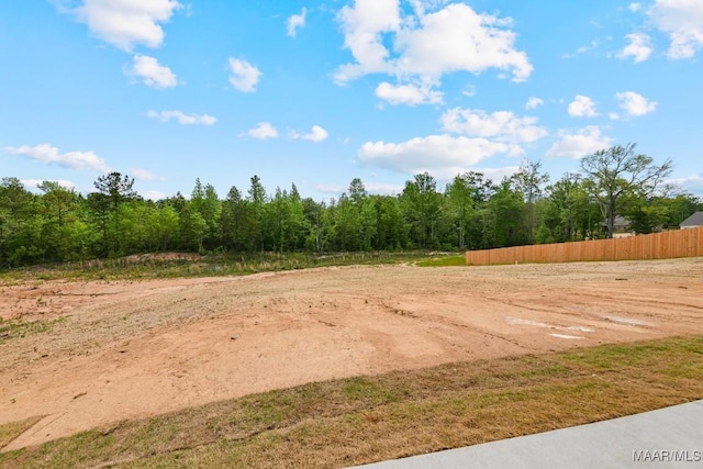 96 Madix Dr, Eclectic, AL 36024 - exterior space featuring fence and a view of trees