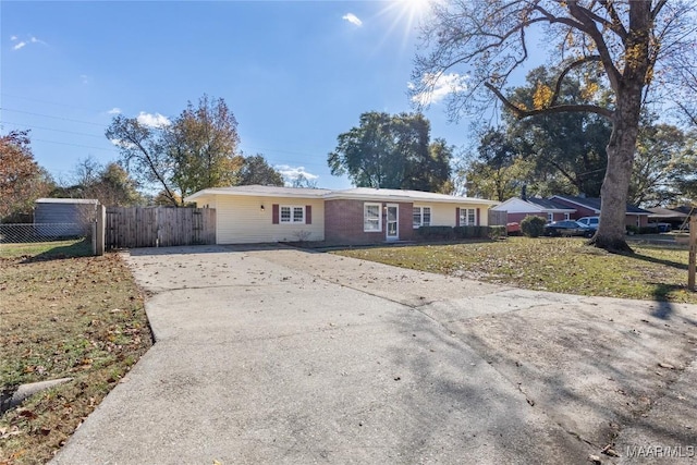 ranch-style house with a front lawn