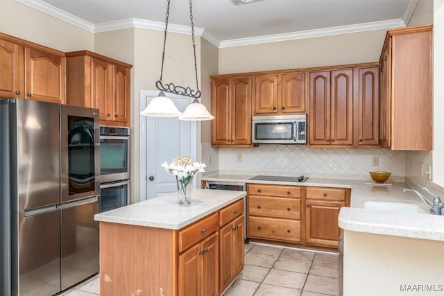 kitchen with pendant lighting, a center island, sink, light tile patterned floors, and stainless steel appliances