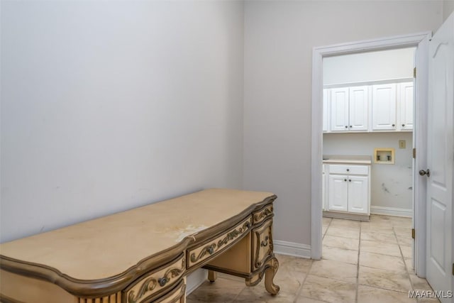 interior space with cabinets and washer hookup