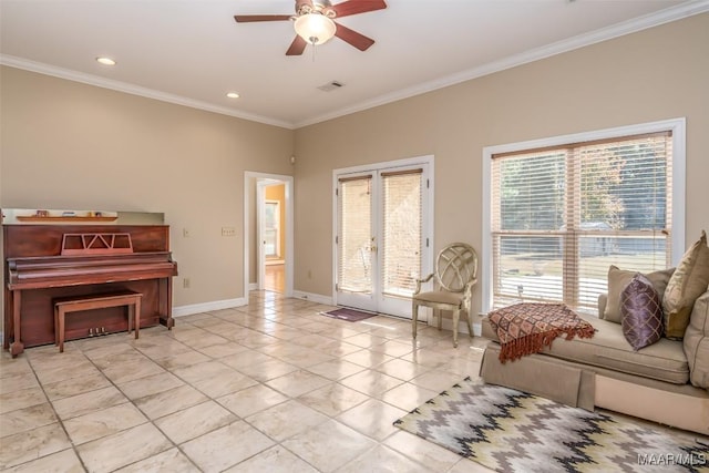 sitting room featuring ceiling fan, ornamental molding, and french doors