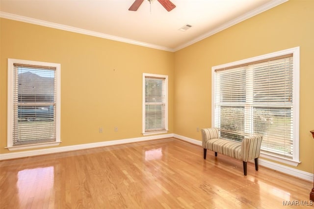 unfurnished room with ceiling fan, ornamental molding, and light hardwood / wood-style flooring