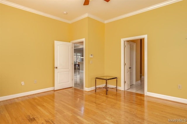 unfurnished room with ceiling fan, wood-type flooring, and ornamental molding