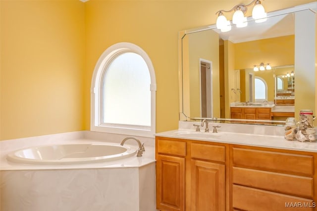 bathroom with a bath and vanity