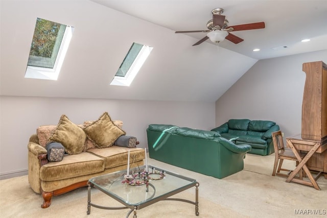 interior space featuring carpet, ceiling fan, and lofted ceiling with skylight