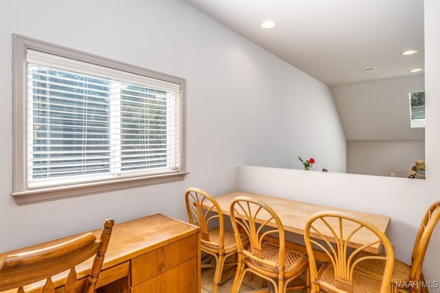 dining room featuring vaulted ceiling