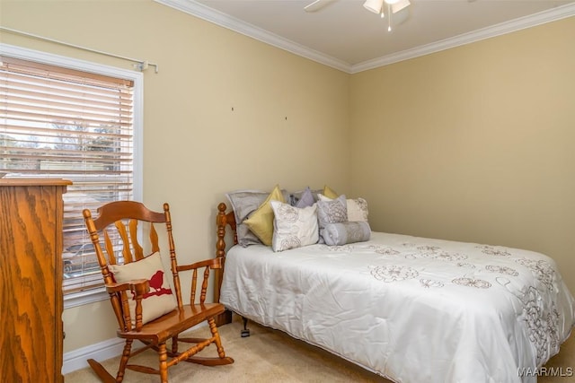 bedroom with carpet floors, ceiling fan, and crown molding