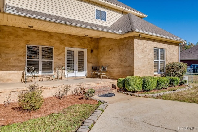 property entrance with french doors and a patio area