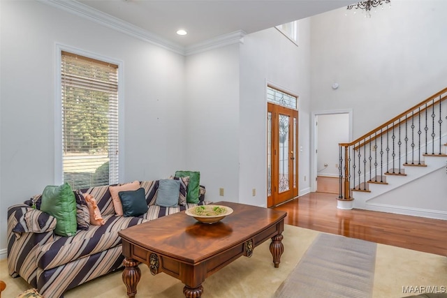 dining room with crown molding, french doors, and wood-type flooring