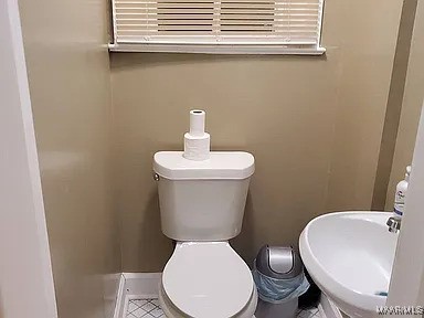 bathroom featuring toilet and sink