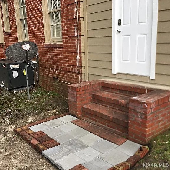 property entrance with cooling unit