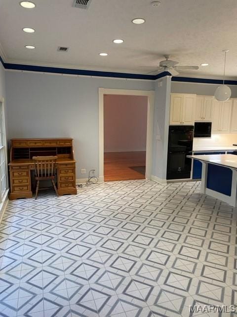 kitchen featuring pendant lighting, crown molding, ceiling fan, double oven, and white cabinetry