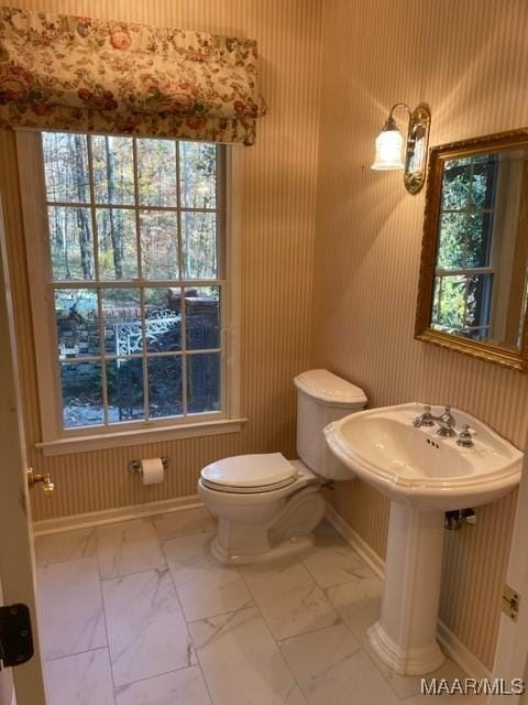 bathroom featuring toilet and sink