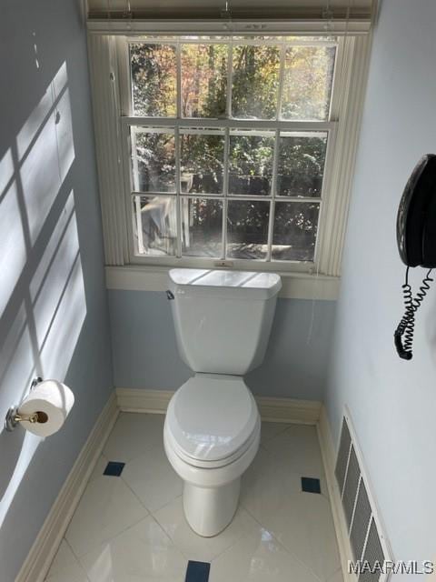 bathroom with tile patterned flooring and toilet