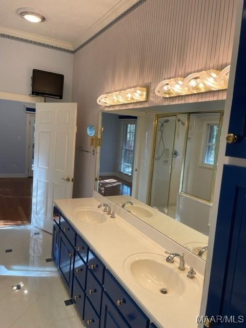 bathroom with vanity and crown molding