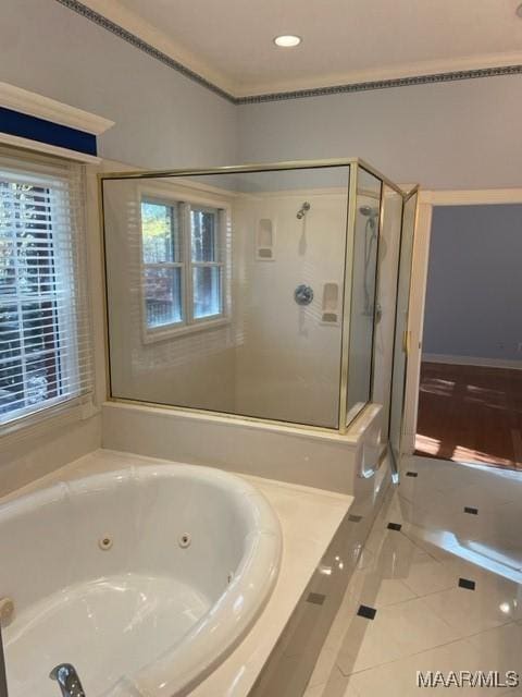 bathroom featuring tile patterned flooring and plus walk in shower